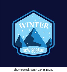 Winter mountain and snowfall in round on blue background. Snowy mountain landscape in new winter season. Badge, emblem, idea for company style or logo