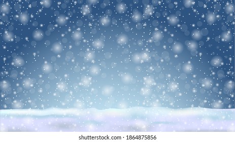 Winter natural blue background with falling snowflakes