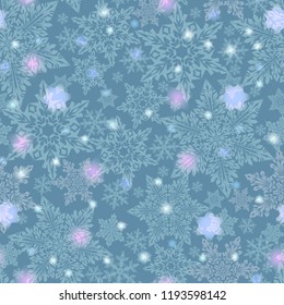 Winter New Year pattern of snowflakes on a blue background. As a packing material or background.