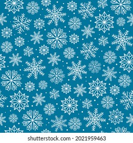 Patrón invernal de copos de nieve en un fondo azul. Gráficos vectoriales. 