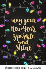 Winter New Year quote. Modern calligraphy style handwritten lettering. Hand drawn decorative colorful flashlights. Vector illustration for cards, leaflets or cups on chalkboard background.