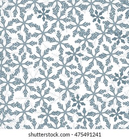 Winter pattern with variety of snowflakes on a light background.