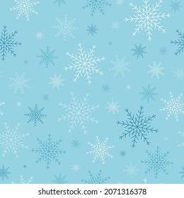 Winter pattern white and blue snowflakes, seamless background.