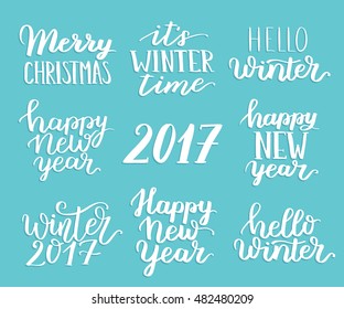 Winter quotes collection. Vector hand written lettering about winter, christmas and new 2017 year. White ink on blue background.