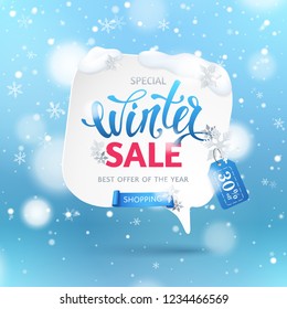 Winter sale banner with paper speech bubble, ribbon, snowflakes and text. Blue background with snowfall and hanging tag for design of flyers with discount offers and special seasonal retail promotion.