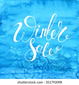 Winter Sale banner. Vector blue watercolor background. Calligraphy. Lettering.  Frost pattern.