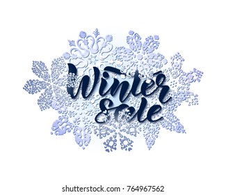 Winter sale. Composition from hand drawn lettering and openwork snowflakes. For advertisements and banners. Vector illustration.