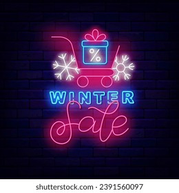 Winter sale neon signboard. Shopping cart sign with present. Special offer banner. Season shopping. Marketing holiday label. Happy New Year and Merry Christmas. Vector stock illustration