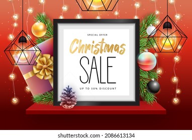 Winter sale poster with christmas holiday decorations. Chrisrmas background with string of lights. 3D interior design with black frame on red walll shelf.