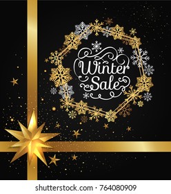 Winter sale poster in decorative frame made of golden snowflakes, glittering stars, snowballs of gold in x-mas border isolated on black vector with bow
