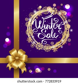 Winter sale poster in decorative frame made of silver and golden snowflakes on blue with round blurred sparkling elements decorated with bow in corner