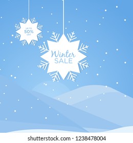 Winter sale promo poster ads. Flat paper snowflake tag with long shadow and winter forest on the blue background. Web banner for e-commerce