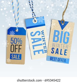 Winter sale. Realistic tags in vintage style on winter background with snowflakes. Vector illustration.