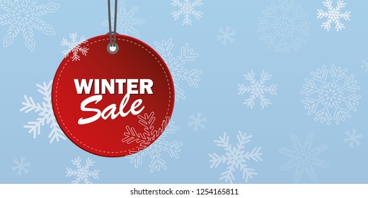 winter sale red label on snowy blue background vector illustration EPS10