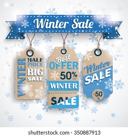 Winter sale ribbon with cardboard price stickers and snowflakes. Eps 10 vector file.