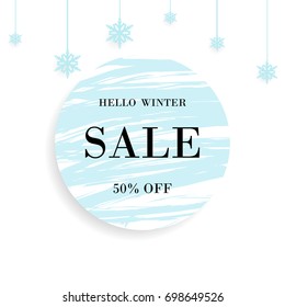 Winter Sale. Special offer banner With lettering hello winter, christmas ball and snowflakes design element and blue circle brush stroke background for business, promotion and advertising.
