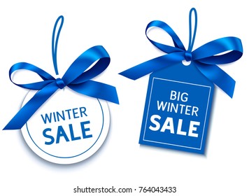 Winter sale tag with blue bow for your design. Vector set of discount labels