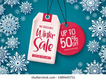 Winter sale tags vector banner.Sale tags hanging with falling snowflakes in blue background for business promotions. Vector illustration.