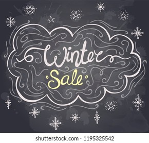 Winter sale text on a chalkboard. Hand drawn lettering. Vector illustration.