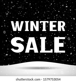 Winter sale text with shadow, snowfall and snowy hill. Christmas holiday snowdrift. Snow falls in black dark background. Big and small snowflakes falling from night sky