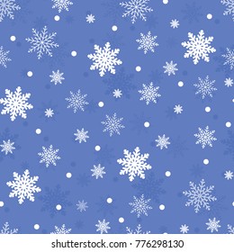 Winter seamless background with flat white snowflakes on a blue 