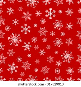 Winter seamless background with white snowflakes on red background