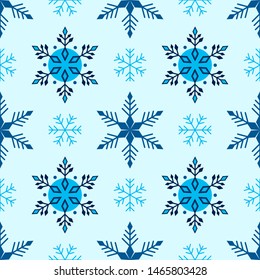 Winter seamless blue pattern with snowflakes geometric style.