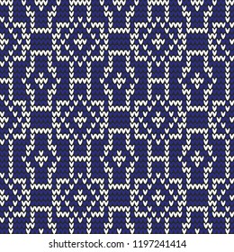 Winter seamless knitted pattern. White geometric shapes on a blue background. In the national, eastern ethnic style. For design, sweater, design