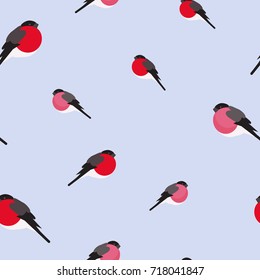 Winter seamless pattern of bullfinch birds. Blue background vector illustration. Merry Christmas design for fabric and paper, surface textures.