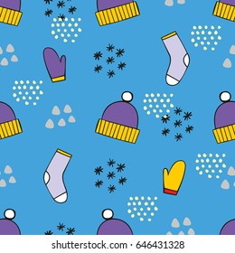 Winter seamless pattern with caps and gloves on a blue background. Vector decorative background for design and decoration of textiles, packaging and other surfaces