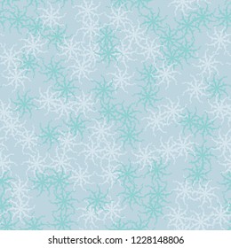 Winter seamless pattern with chaotic snowflakes in different shades of blue color. Light Christmas repeat backdrop using for cards, wallpapers, scrapbooking, print, gift wrap, UFO camouflage etc.