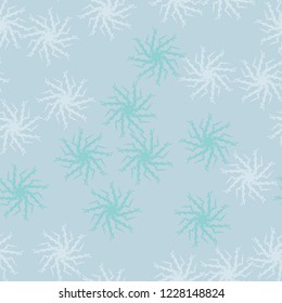 Winter seamless pattern with chaotic snowflakes in different shades of blue color. Light Christmas repeat backdrop using for cards, wallpapers, scrapbooking, print, gift wrap, UFO camouflage etc.