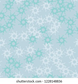 Winter seamless pattern with chaotic snowflakes in different shades of blue color. Light Christmas repeat backdrop using for cards, wallpapers, scrapbooking, print, gift wrap, UFO camouflage etc.