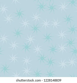 Winter seamless pattern with chaotic snowflakes in different shades of blue color. Light Christmas repeat backdrop using for cards, wallpapers, scrapbooking, print, gift wrap, UFO camouflage etc.