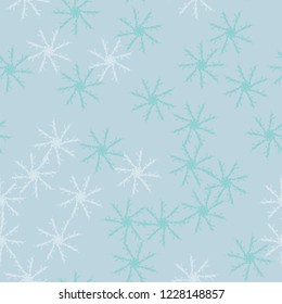 Winter seamless pattern with chaotic snowflakes in different shades of blue color. Light Christmas repeat backdrop using for cards, wallpapers, scrapbooking, print, gift wrap, UFO camouflage etc.