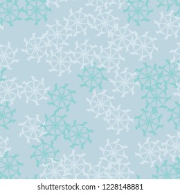 Winter seamless pattern with chaotic snowflakes in different shades of blue color. Light Christmas repeat backdrop using for cards, wallpapers, scrapbooking, print, gift wrap, UFO camouflage etc.