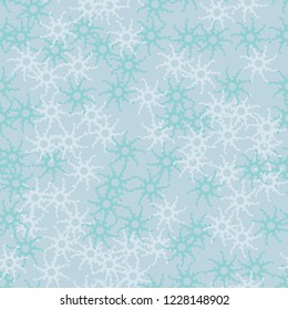 Winter seamless pattern with chaotic snowflakes in different shades of blue color. Light Christmas repeat backdrop using for cards, wallpapers, scrapbooking, print, gift wrap, UFO camouflage etc.