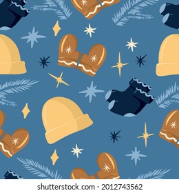 Winter seamless pattern with winter elements, knitted hat, mittens, socks, fir branch, stars, cozy and cute pattern, cartoon and simple style, hygge, blue background, vector