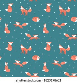 Winter seamless pattern with funny cartoon foxes. Woodland animals with snowflakes on green background. Flat vector illustration.