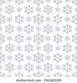 Winter seamless pattern with grey snowflakes on white background. Vector illustration for fabric, textile wallpaper, posters, gift wrapping paper. Christmas vector illustration. Falling snow.
