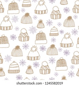 winter seamless pattern with hand drawn knitted hats and snowflakes on a white background