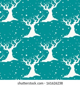 Winter seamless pattern with leafless tree silhouettes and falling snow.