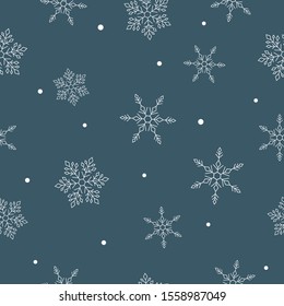 Winter seamless pattern. Light snowflakes on deep grey-blue background.