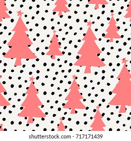 Winter seamless pattern with red Christmas trees and black dots on white background.