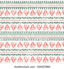 Winter seamless pattern with reindeer and geometric ornament. Primitive ethnic (tribal) style with hand drawn ornament. Read and green palette with a grunge texture