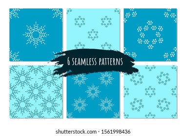 Winter seamless pattern set on blue background for gift paper, decor, fabric. Artistic collection of doodle elements and ink textures. Brush stroke holiday snowflakes. Winter symbol.