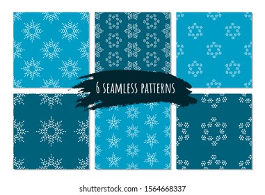 Winter seamless pattern set on blue background for gift paper, decor, fabric. Artistic collection of doodle elements and ink textures. Brush stroke holiday snowflakes. Winter symbol.