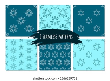 Winter seamless pattern set on blue background for gift paper, decor, fabric. Artistic collection of doodle elements and ink textures. Brush stroke holiday snowflakes. Winter symbol.