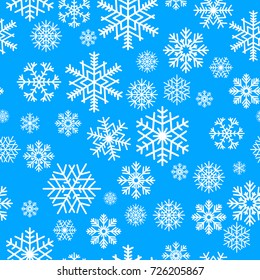 Winter seamless pattern from snowflakes on blue background, Christmas. Vector illustration.