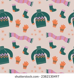 Winter seamless pattern with warm knitted accessories hand drawn flat vector illustration. Repeating background with hat, sweater, scarf, gloves, snowflakes, winter holiday decorative ornament 